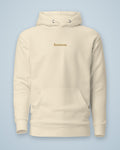 Sweat à capuche heaven. crème, broderie fil doré sur la poitrine, vu de face