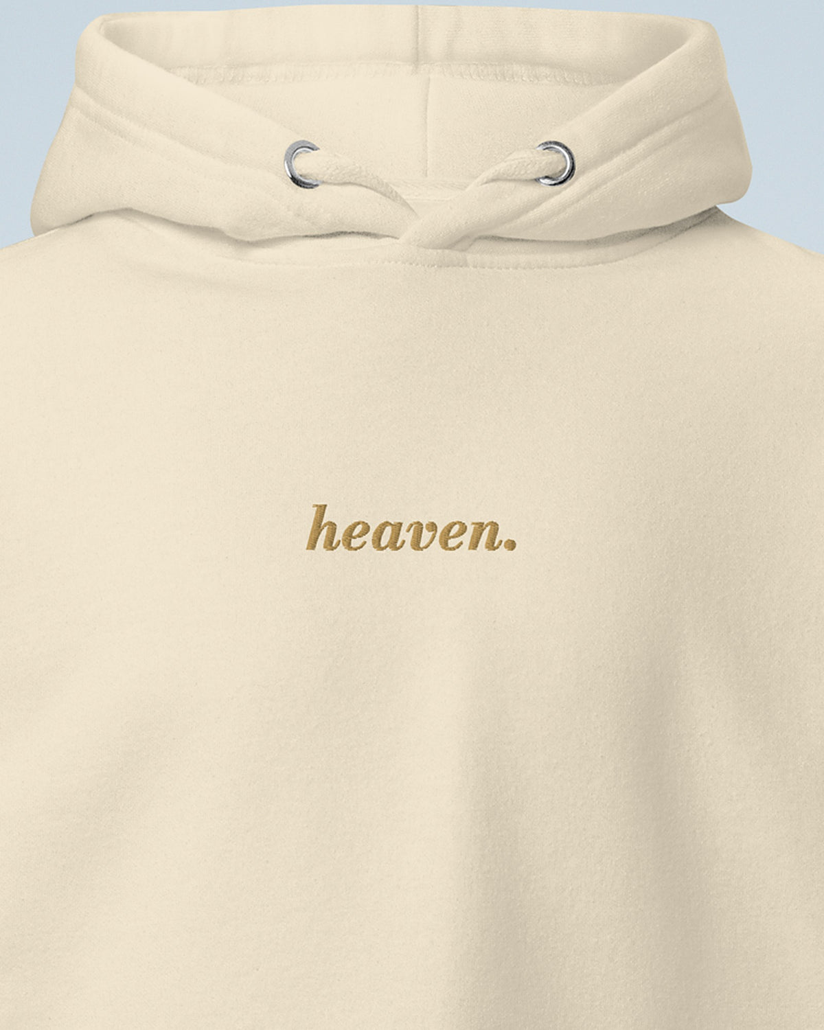 Gros plan sur la broderie heaven. en fil doré